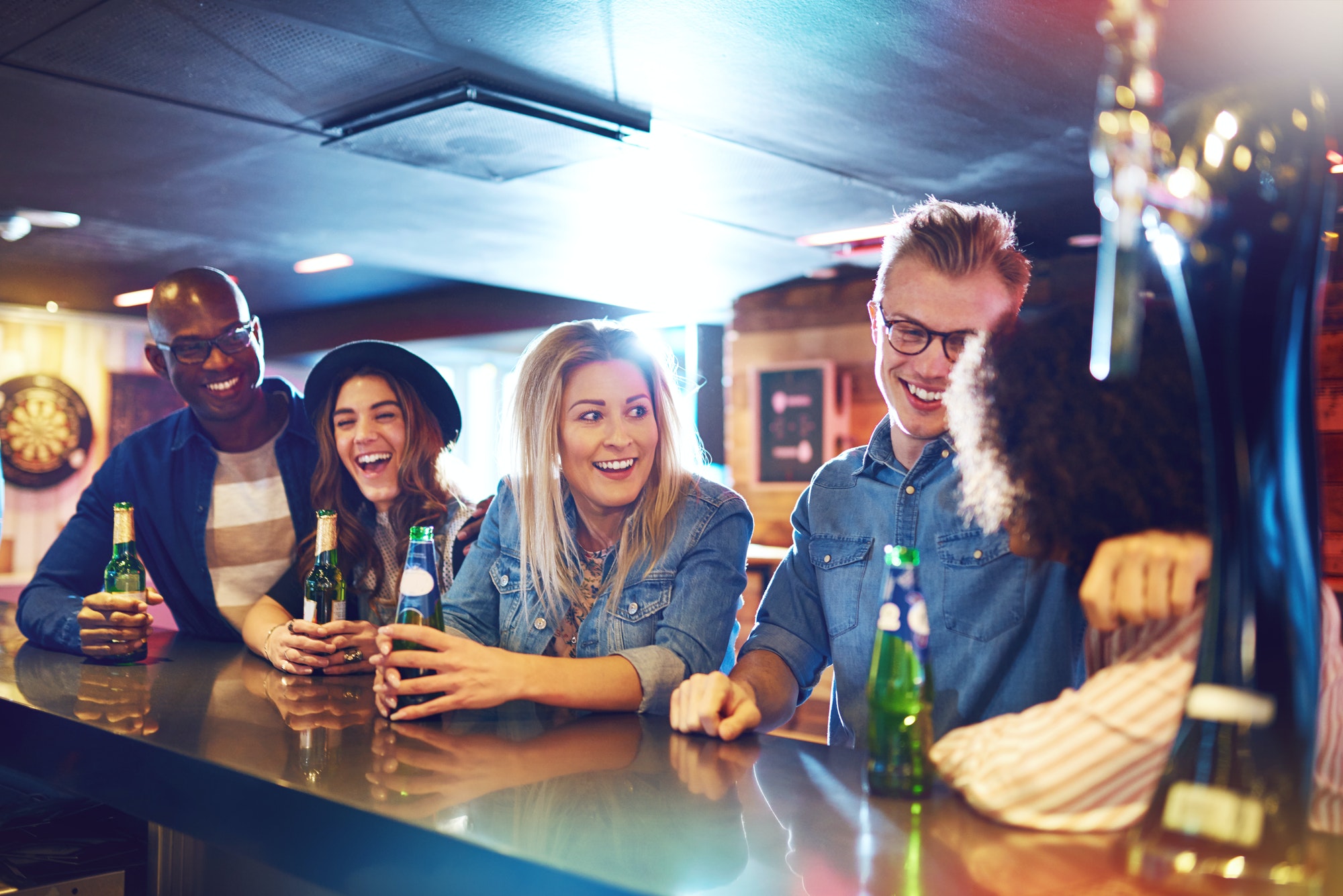 Group of happy people at bar counter